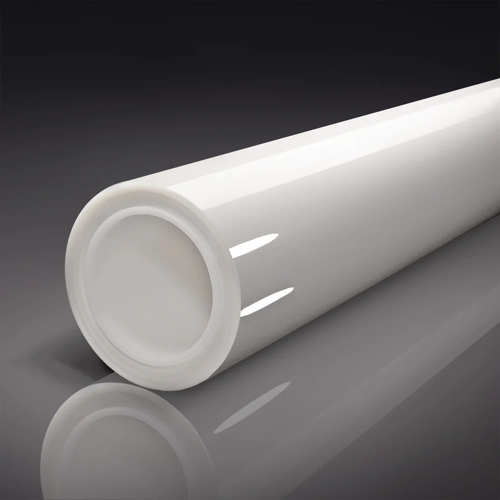 Clear roll of Paint Protection Film  on a reflective surface with a dark background